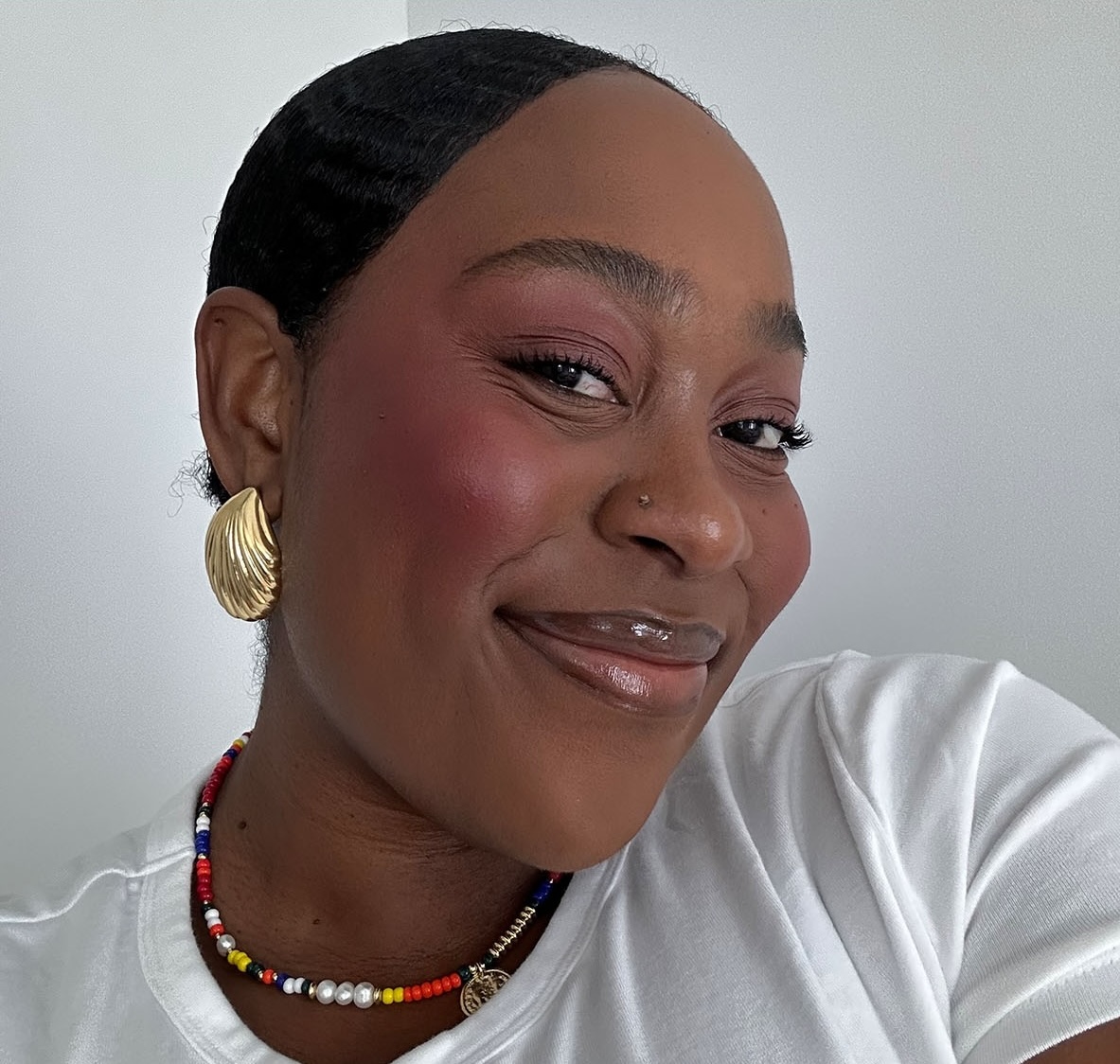 Who What Wear editor Aniyah Morinia testing Ami Colé's Desert Date Cream Multistick.