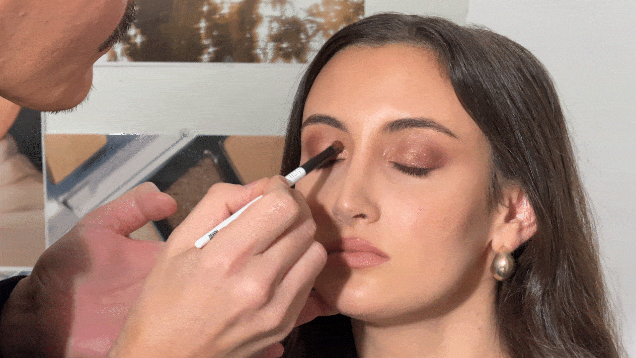 A gif of Alyssa Brascia getting her makeup done by Mario Dedivanovic.