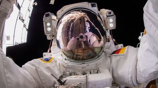 ESA (European Space Agency) astronaut and Expedition 66 Flight Engineer Matthias Maurer points the camera toward himself and takes a "space-selfie" during a six-hour and 54-minute spacewalk to install thermal gear and electronic components on the International Space Station.