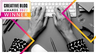 Creative Bloq awards: A person types on a keyboard