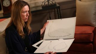 Clare Waight Keller, a fashion designer at Givenchy, holds dress sketches