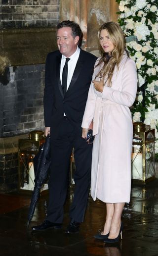 piers morgan and his wife arrive at the ceremony