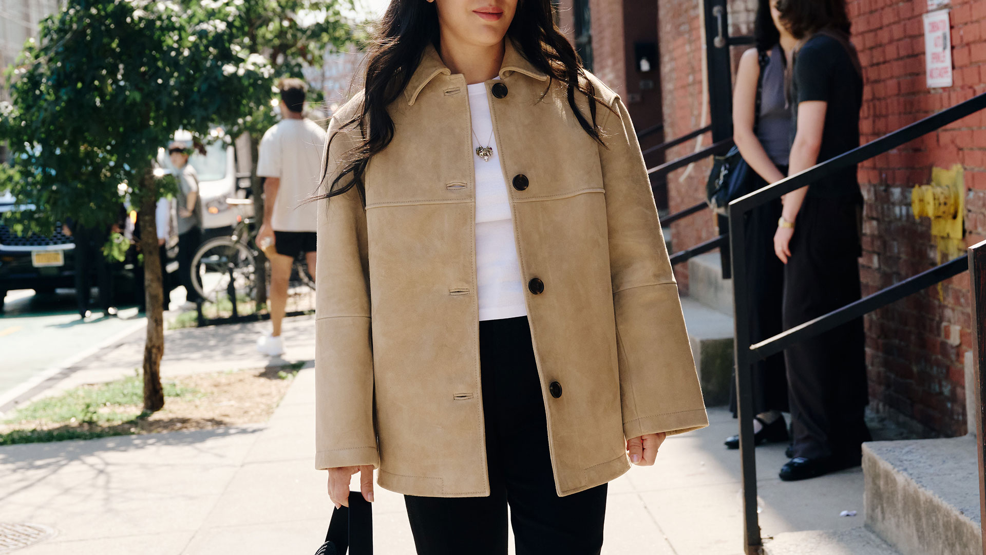 nicole eshaghpour outfit photo in beige suede jacket and sneakers