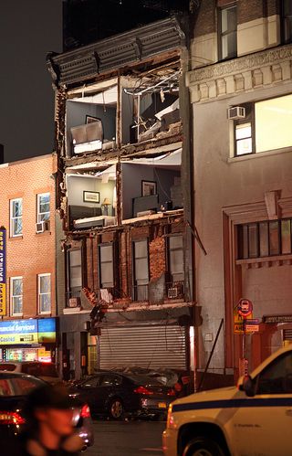 Hurricane Sandy's winds pulled off the front of this 4-floor apartment building in New York City on eighth avenue between 14th and 15th streets.