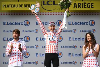 PLATEAU DE BEILLE FRANCE JULY 14 Tadej Pogacar of Slovenia and UAE Team Emirates celebrates at podium as Polka Dot Mountain Jersey winner during the 111th Tour de France 2024 Stage 15 a 1977km stage from Loudenvielle to Plateau de Beille 1782m UCIWT on July 14 2024 in Plateau de Beille France Photo by Dario BelingheriGetty Images