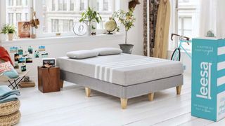 Casper vs Leesa mattress: an image showing a Leesa mattress box next to a bed