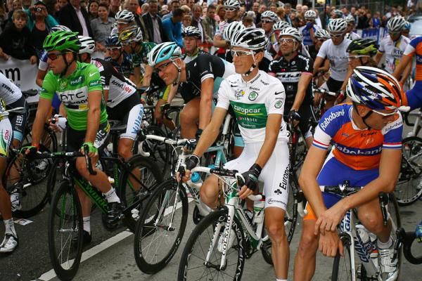 Pierre Rolland shows of his prized white jersey.