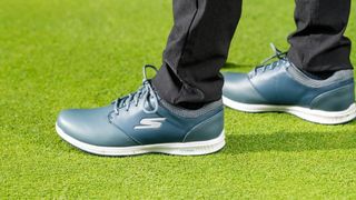 Skechers GO GOLF Elite 4 Hyper Shoe in its cool blue design being sported on the golf course