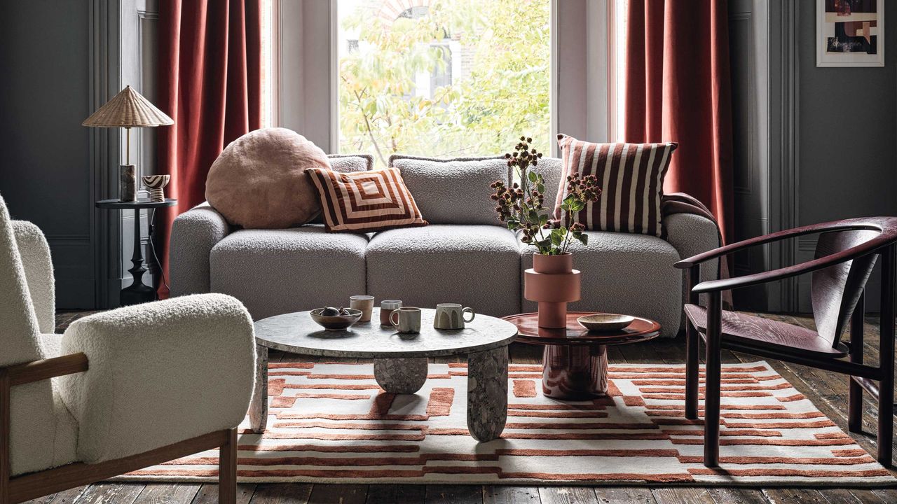 a living room with side and coffee tables