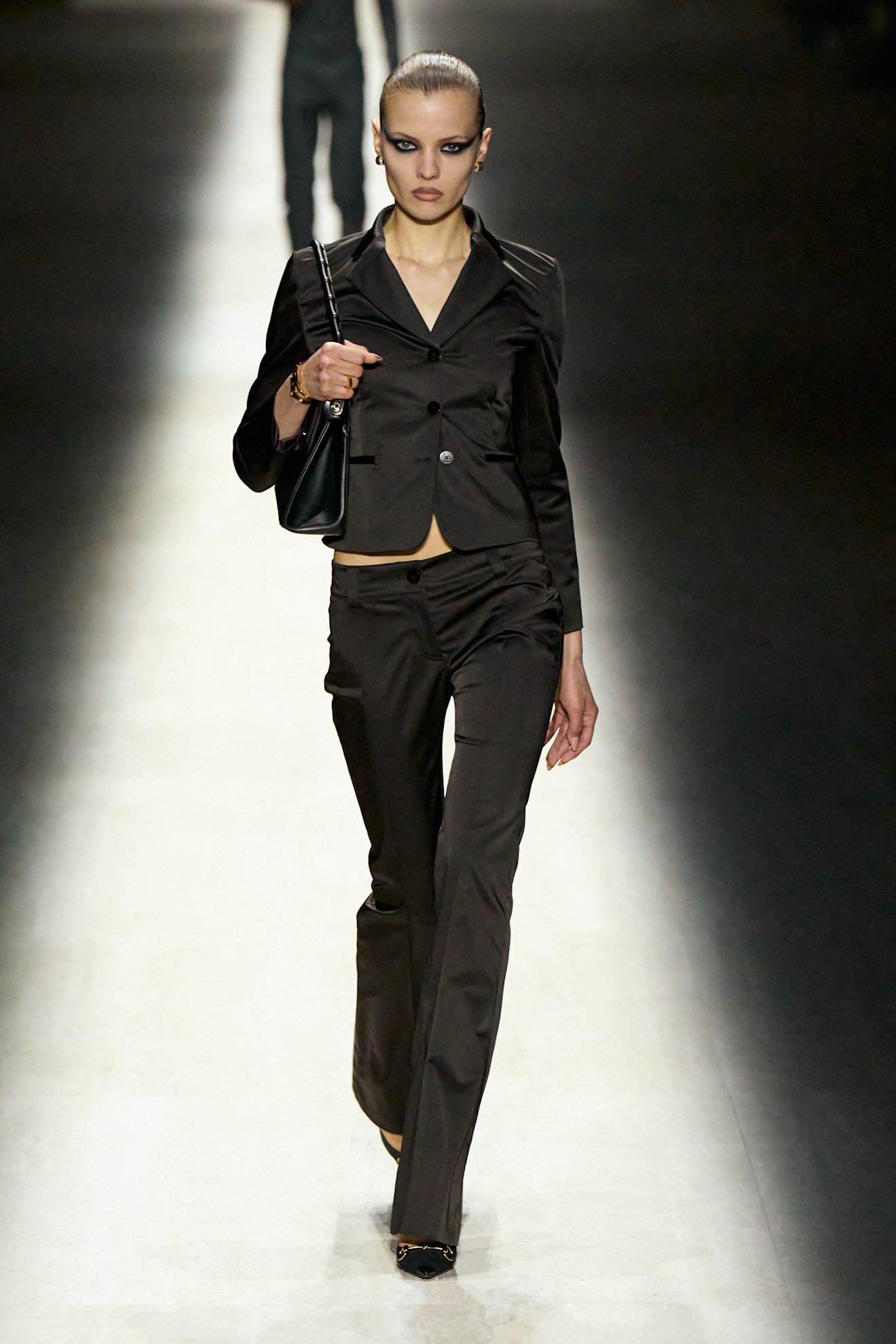 a model walks the Gucci fall/winter 2026 runway show during Milan Fashion Week