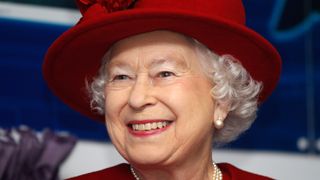 Queen Elizabeth II smiles as she tours RAF Valley