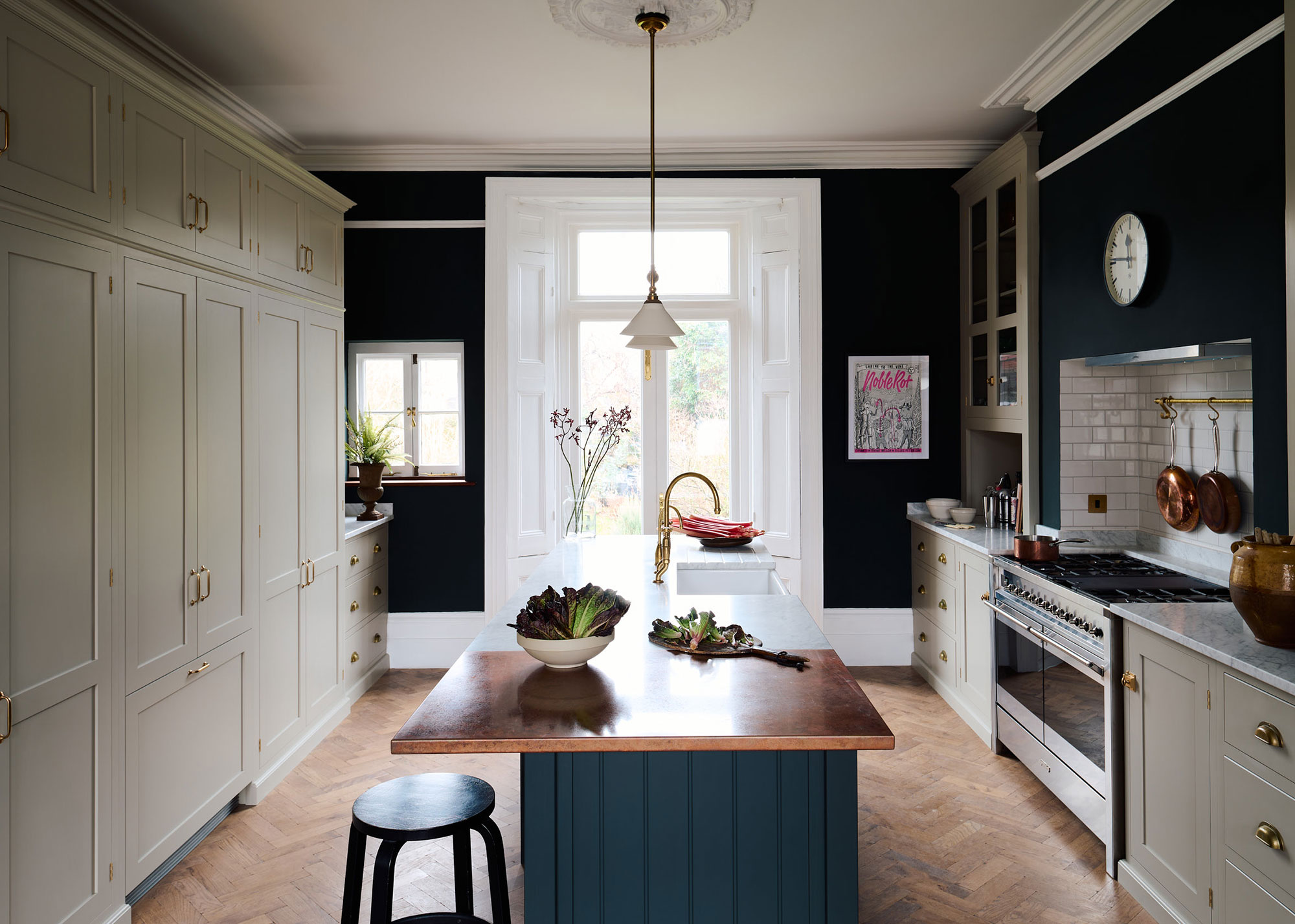 galley kitchen with French doors and full height cream cabinets