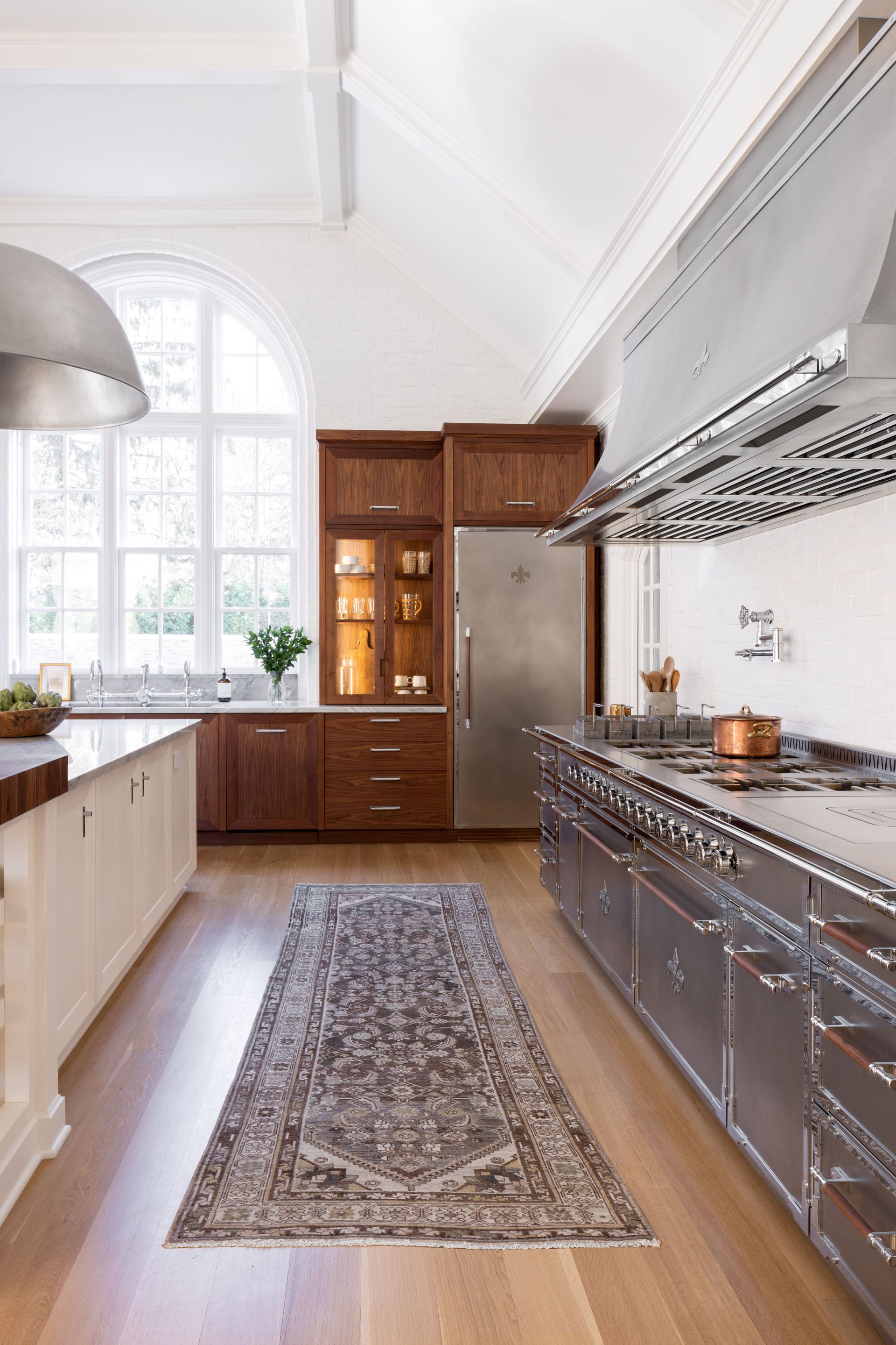 wooden kitchen with steel appliances