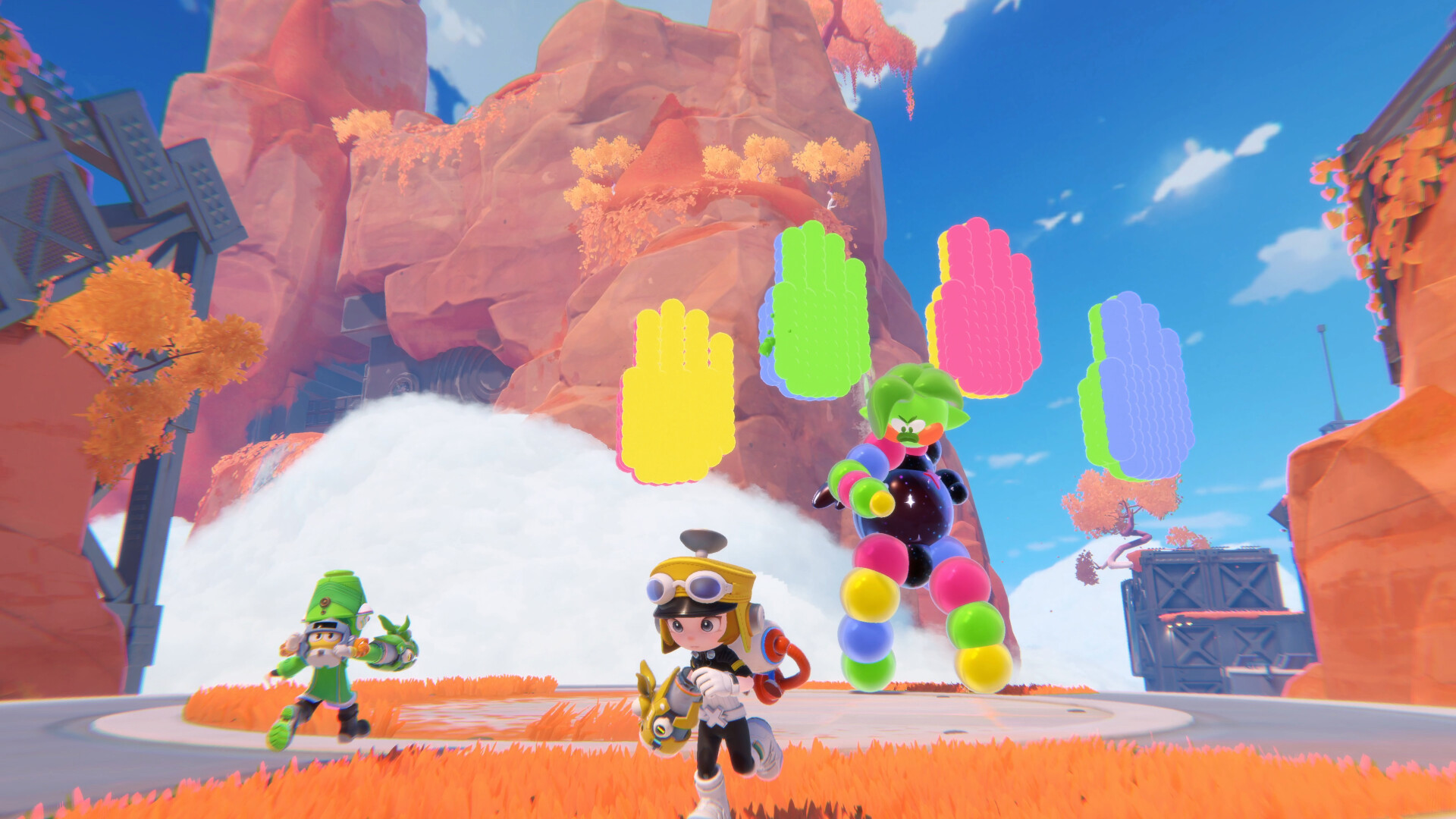 Popucom screenshot showing two adventurers wearing bright hats take on a colorful foe who stands below some different colored hand symbols that float above