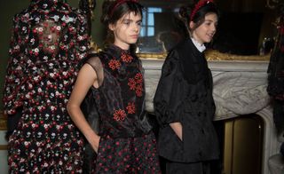 Model wear dresses in black and red floral