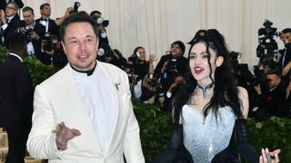 elon musk and grimes arrive for the 2018 met gala on may 7, 2018, at the metropolitan museum of art in new york the gala raises money for the metropolitan museum of arts costume institute the gala's 2018 theme is heavenly bodies fashion and the catholic imagination photo by angela weiss afp photo credit should read angela weissafp via getty images