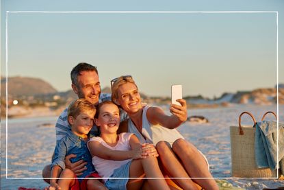 Family posing for a selfie on the beach