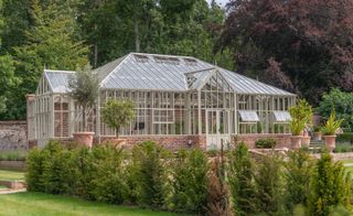 Large brick and glass greenhouse
