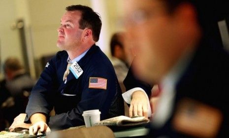 Traders work on the floor of the New York Stock Exchange on Oct. 23
