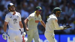 Pat Cummins and Alex Carey celebrating Ollie Pope's dismissal during the Ashes 3rd Test