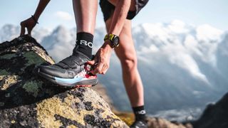 Trail runner wearing Adidas Terrex Agravic Pro shoes