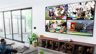 Epson LS800 projector showing football games on wall 