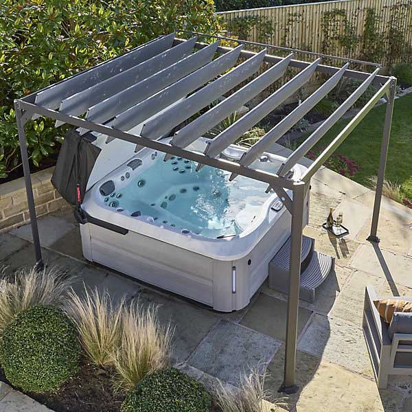 aluminium pergola over the top of a hot tub on a patio