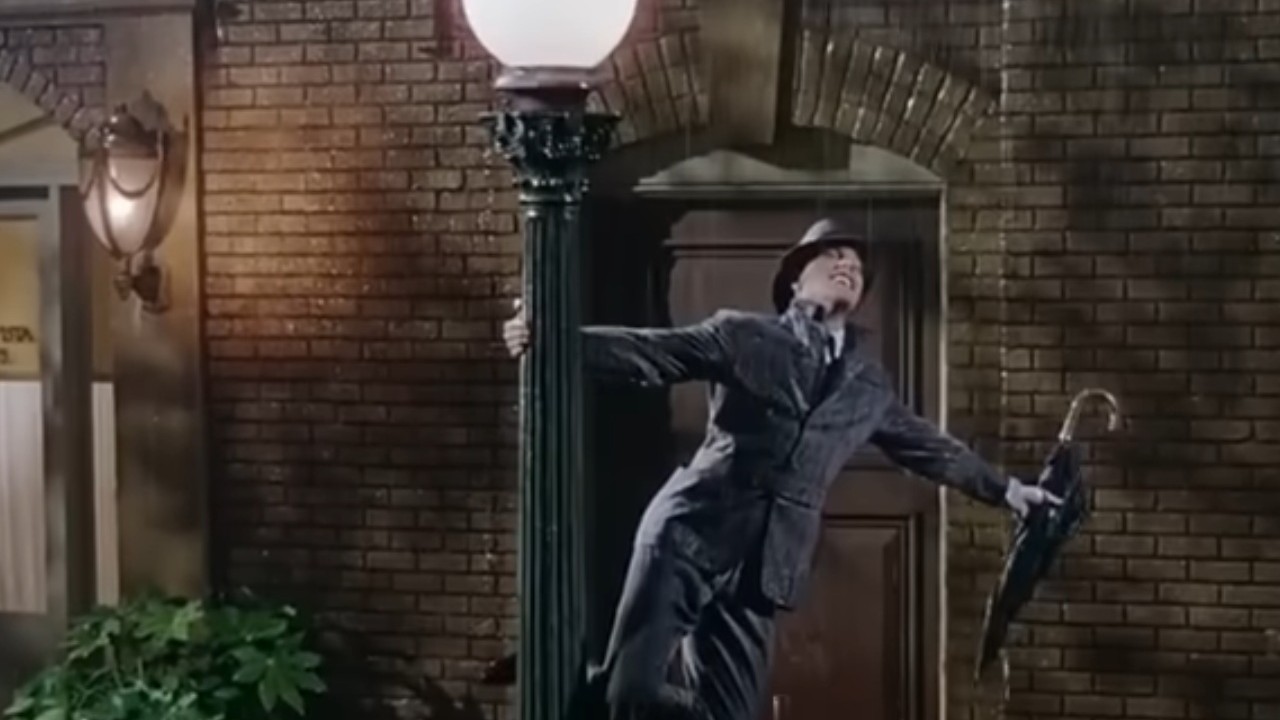 Gene Kelly hanging on a light pole in Singin' in the Rain