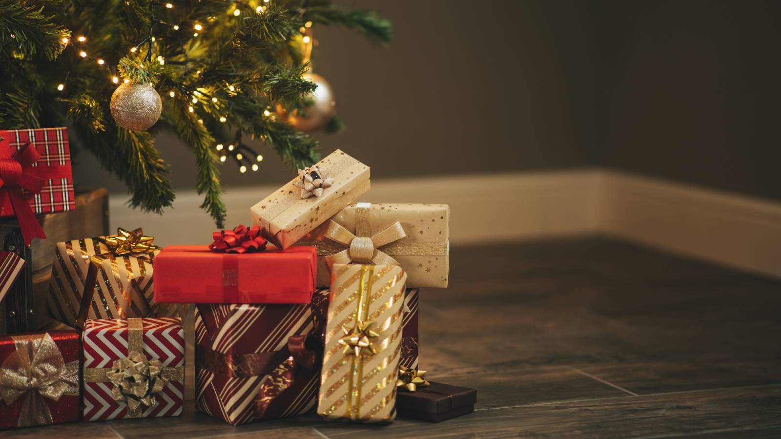 Wrapped Christmas presents under a tree