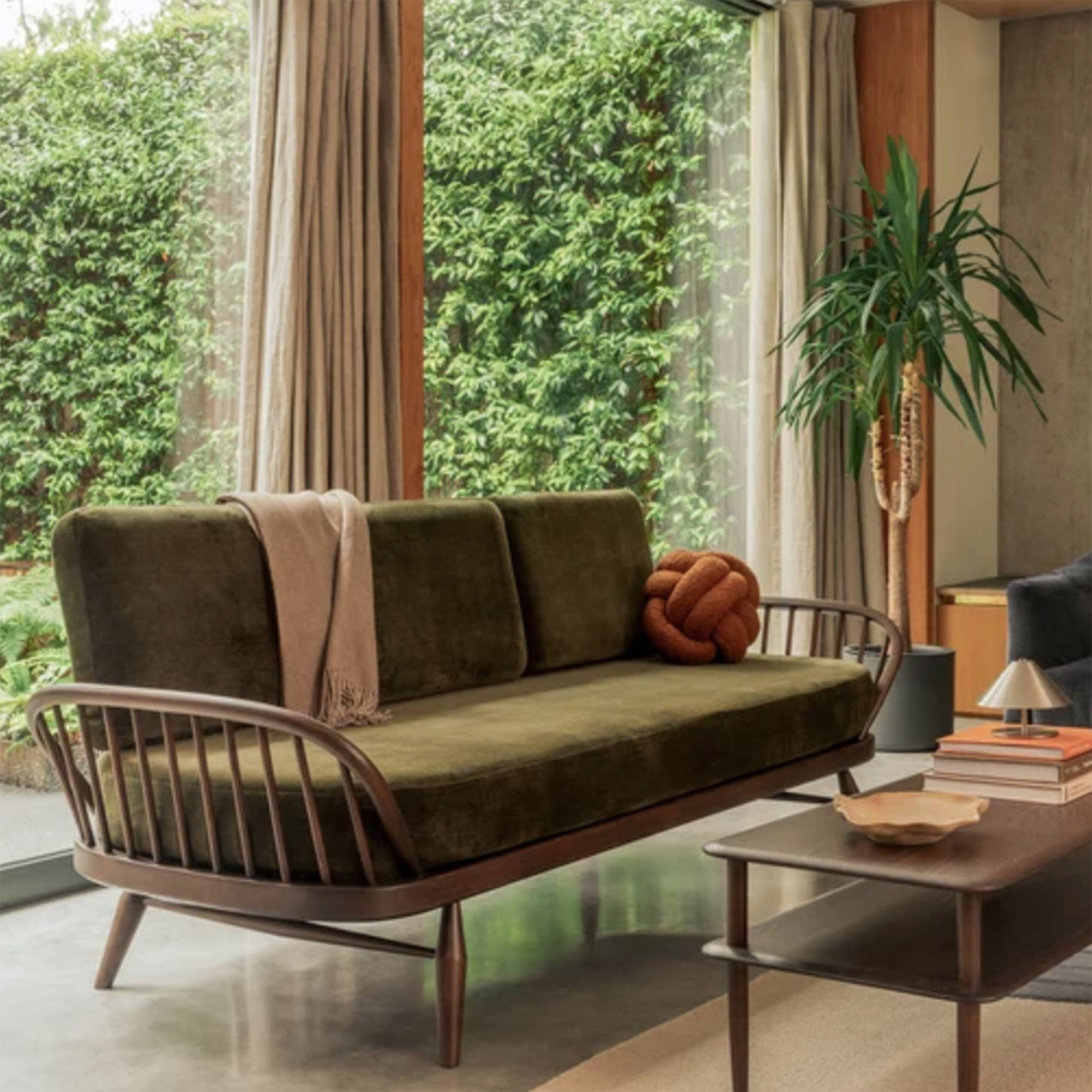 mid century sofa with green seat cushions