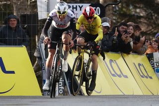 UAE Team Emirates XRG's Portuguese rider Joao Almeida (L) next to Team Visma-Lease a Bike's Danish rider Jonas Vingegaard cycles to the finish line to win the 4th stage of the Paris-Nice cycling race, 163,4 km between Vichy and La Loge des Gardes, on March 12, 2025. (Photo by Anne-Christine POUJOULAT / AFP)