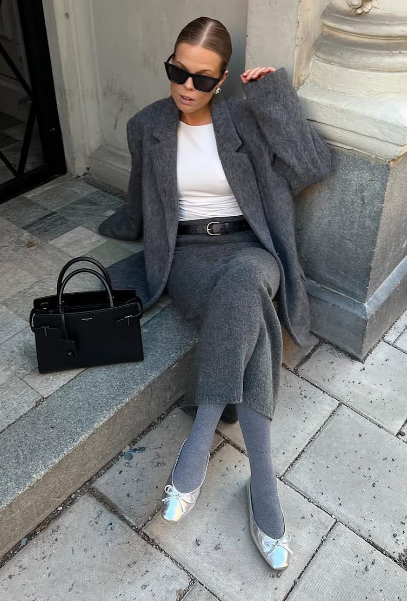 @haaannajohansson wears a grey wool skirt with a blazer, white tee and silver ballet flats