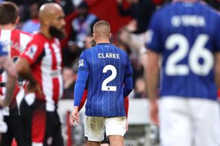 Harry Clarke of Ipswich Town leaves the pitch after being shown a red card following a second yellow card for a foul on Keane Lewis-Potter of Brentford (not pictured) during the Premier League match between Brentford FC and Ipswich Town FC at Gtech Community Stadium on October 26, 2024 in Brentford, England.