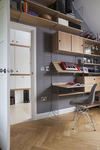 wooden open shelving cabinet, desk and office space