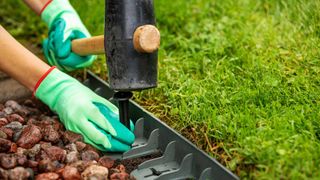 installing lawn edging with mallet