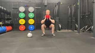 TechRadar fitness writer Harry Bullmore performing a goblet squat