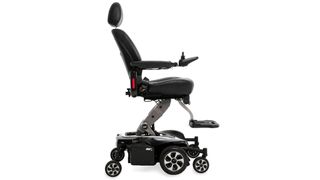 The Pride Mobility Jazzy Air 2, in black, photographed from the side to give an overview of the sturdy base while multiple wheels and built-in suspension