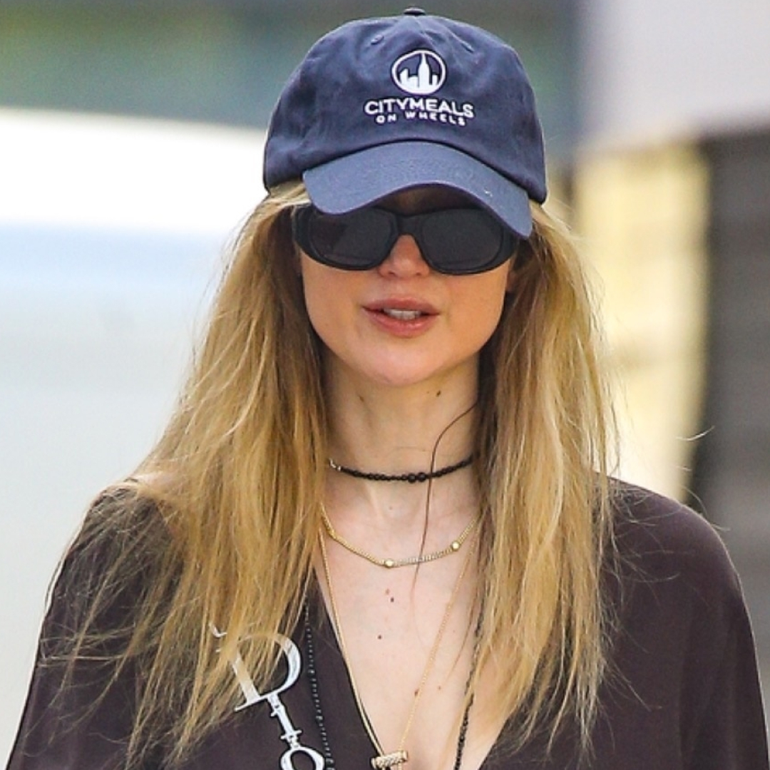 Jennifer Lawrence enjoyed the spring weather in last summer's favorite The Row Dune flip-flops and a monogrammed Dior bag