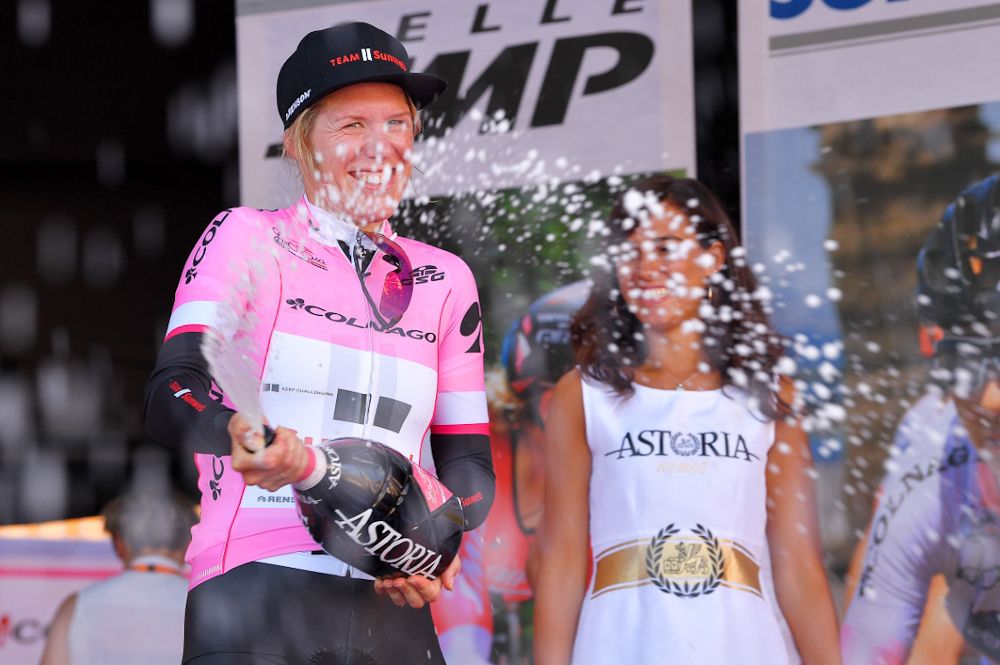 Ellen van Dijk celebrates on the podium after the opening team time trial at the Giro Rosa