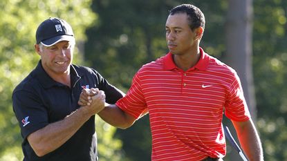 Steve Williams congratulates Tiger Woods after he wins the 2006 Deutsche Bank Championship