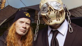 Megadeth singer/guitarist Dave Mustaine standing next to the band's skeleton mascot Vic Rattlehead