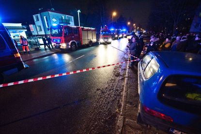 Police and firefighters stand in front of a place, where a fire that broke out in an escape room killed five teenage girls, in the northern Polish city of Koszalin on January 4, 2019. 