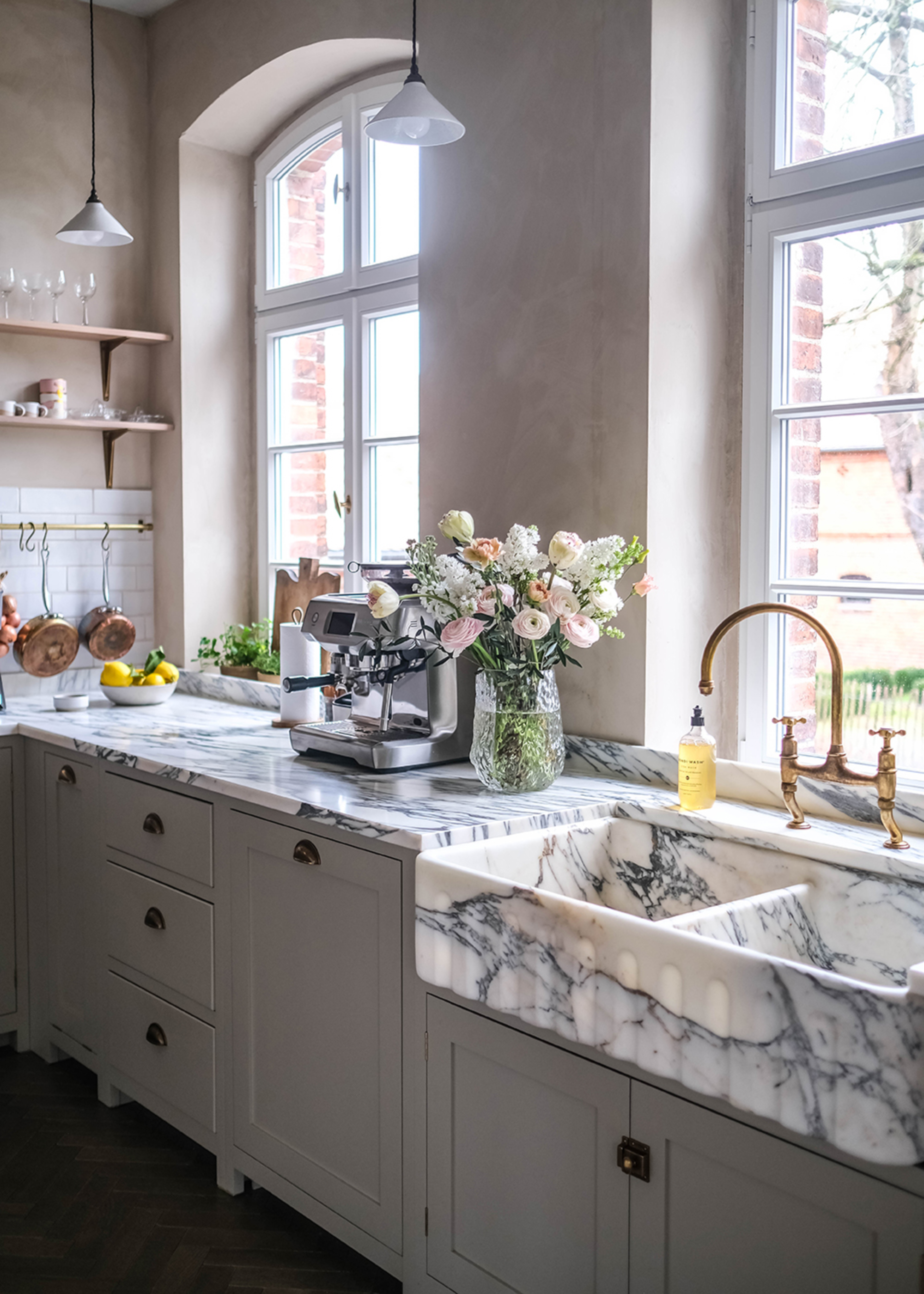 relaxed looking kitchen with marble sink