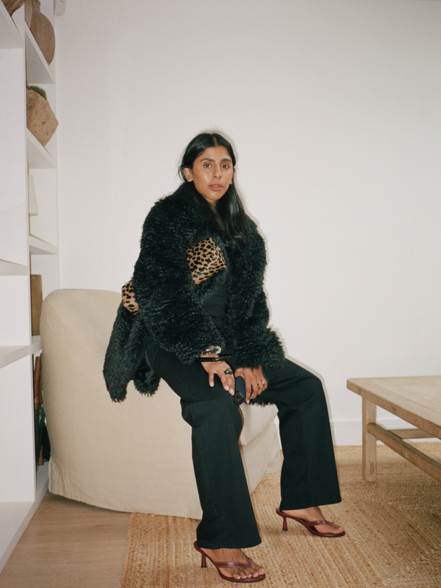 An image of @monikh with one of 2026's biggest bag trends, the clutch bag.