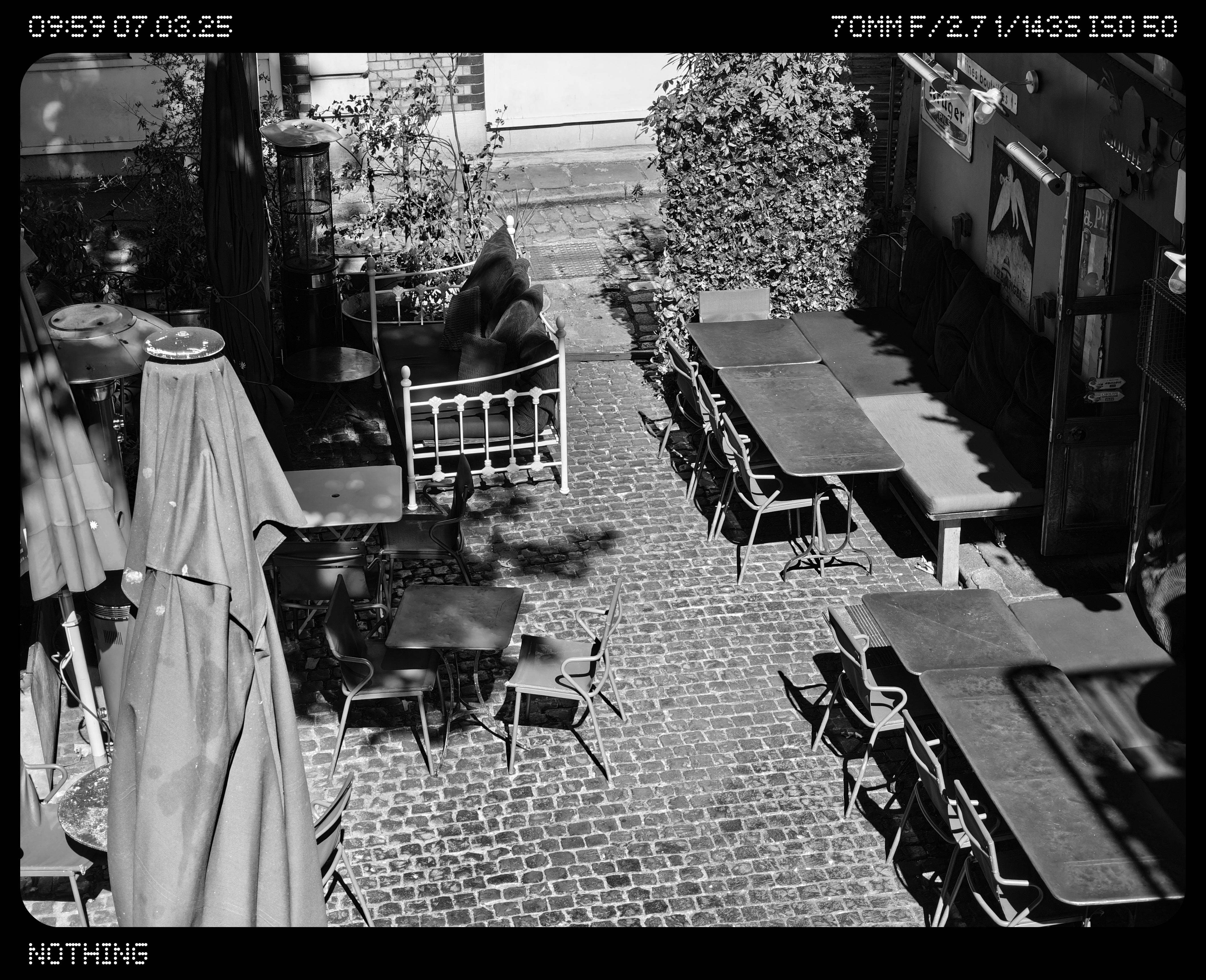 A courtyard full of tables and chairs