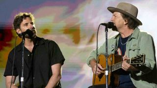 Actor Bradley Cooper and Pearl Jam’s Eddie Vedder performing onstage together