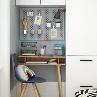 study desk with chair and peg board