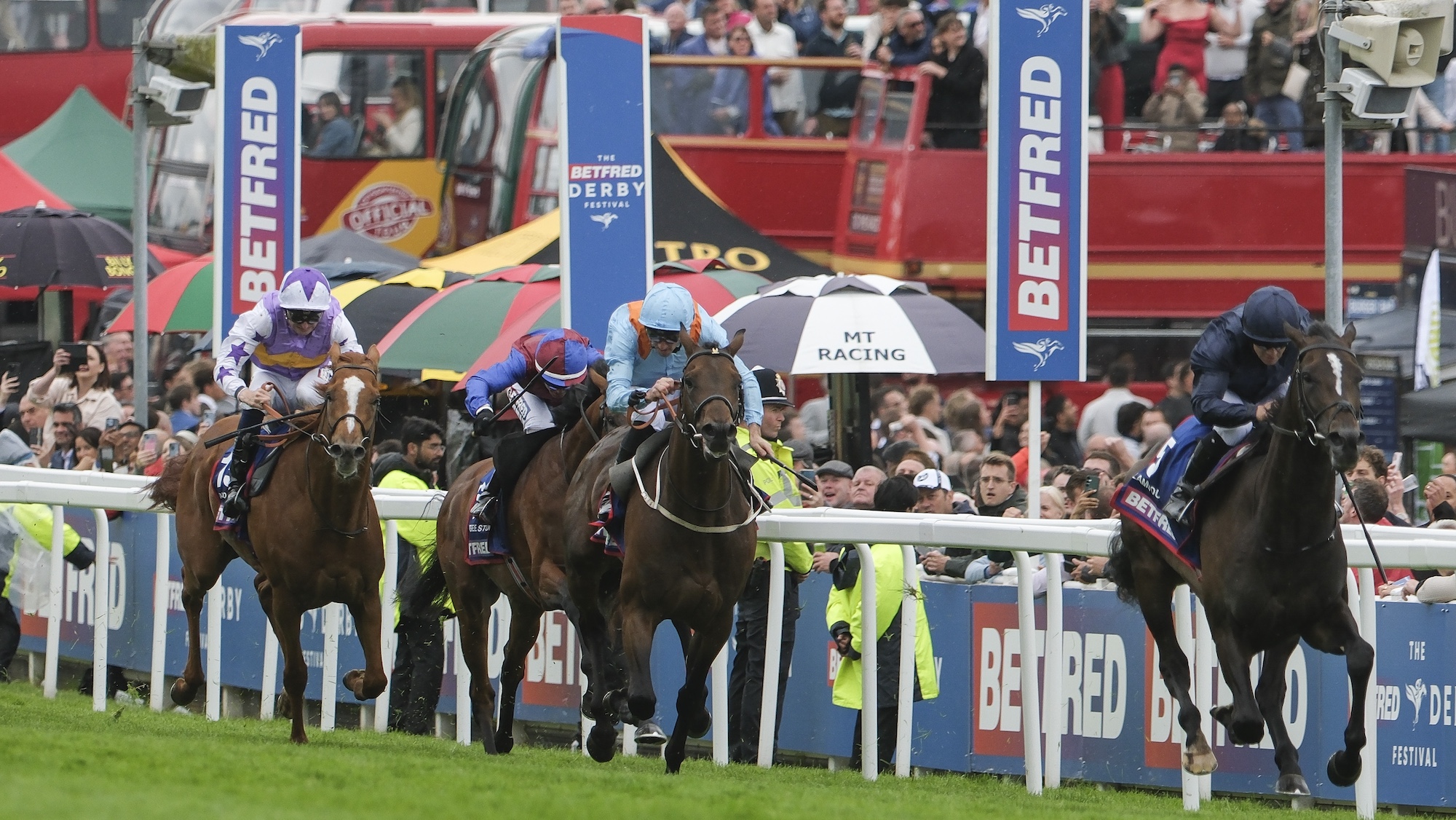 Image shows the action at the 2025 Derby. Winner Lambourn leads the field home in front of the crowds.