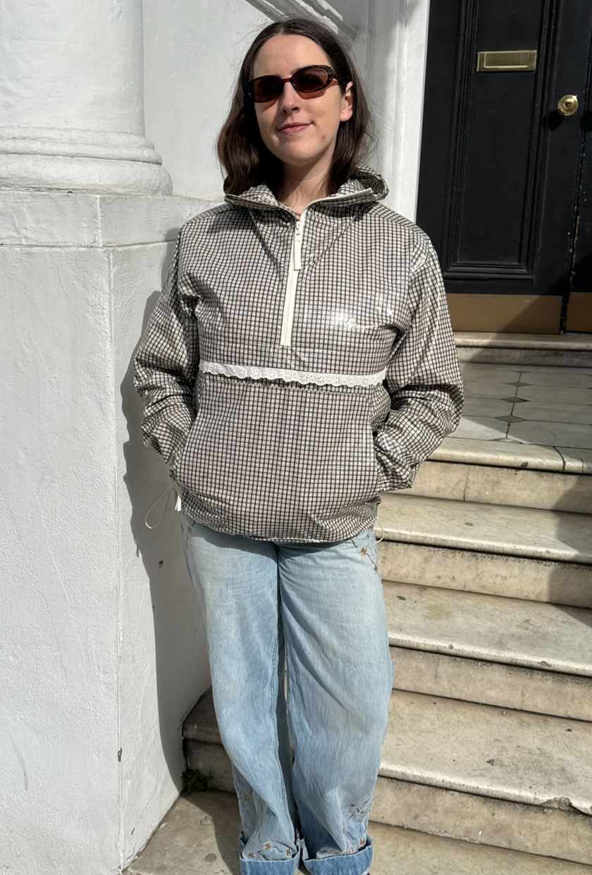 An image of Who What Wear UK assistant social media editor Annie Wheatland-Clinch wearing a Ganni raincoat .