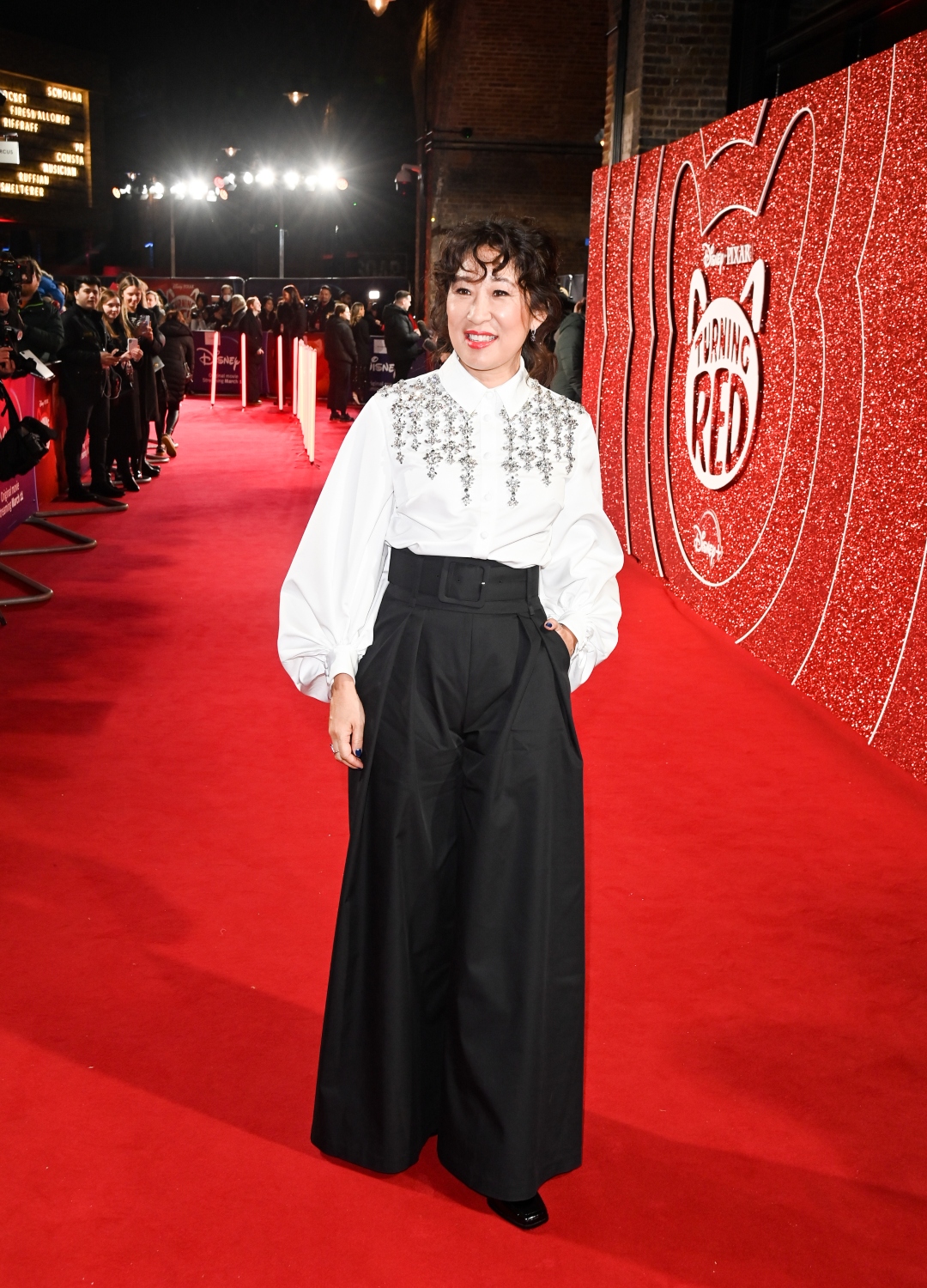 Sanra Oh wearing trousers